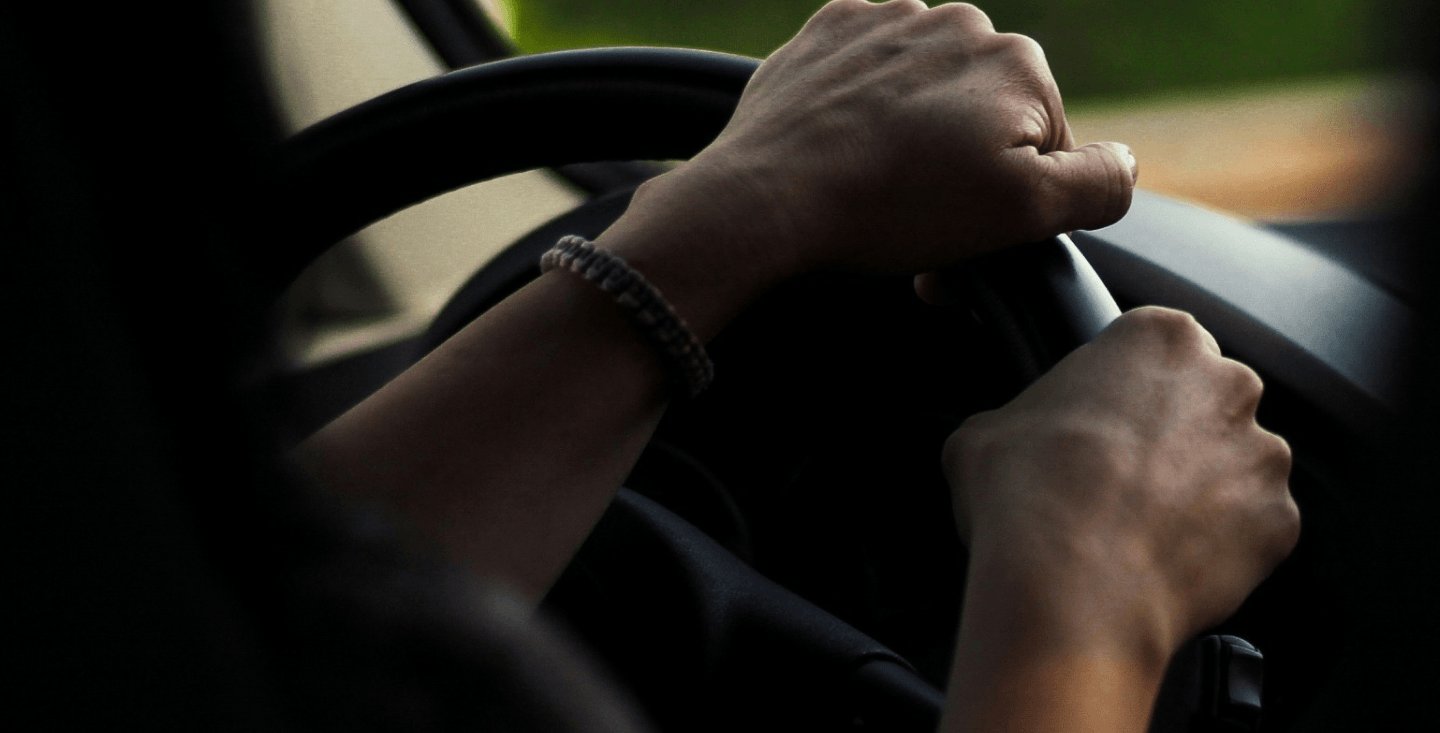 man on steering wheel